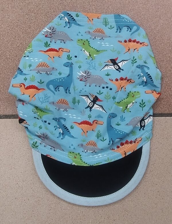 2.4 Fascia bambini con visiera DINOSAURI AZZURRO